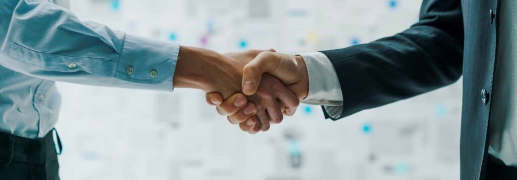 Business partners shaking hands